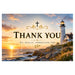 A square thank-you card featuring a scenic coastal sunset with a lighthouse, rocks, and ocean, overlaid with the words “THANK YOU” and “WE REALLY APPRECIATE YOU” in gold and black text with decorative leaf and cross motifs.