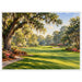 Watercolor golf course with a sunlit fairway framed by moss-draped oak trees, colorful flowers and a sand bunker.